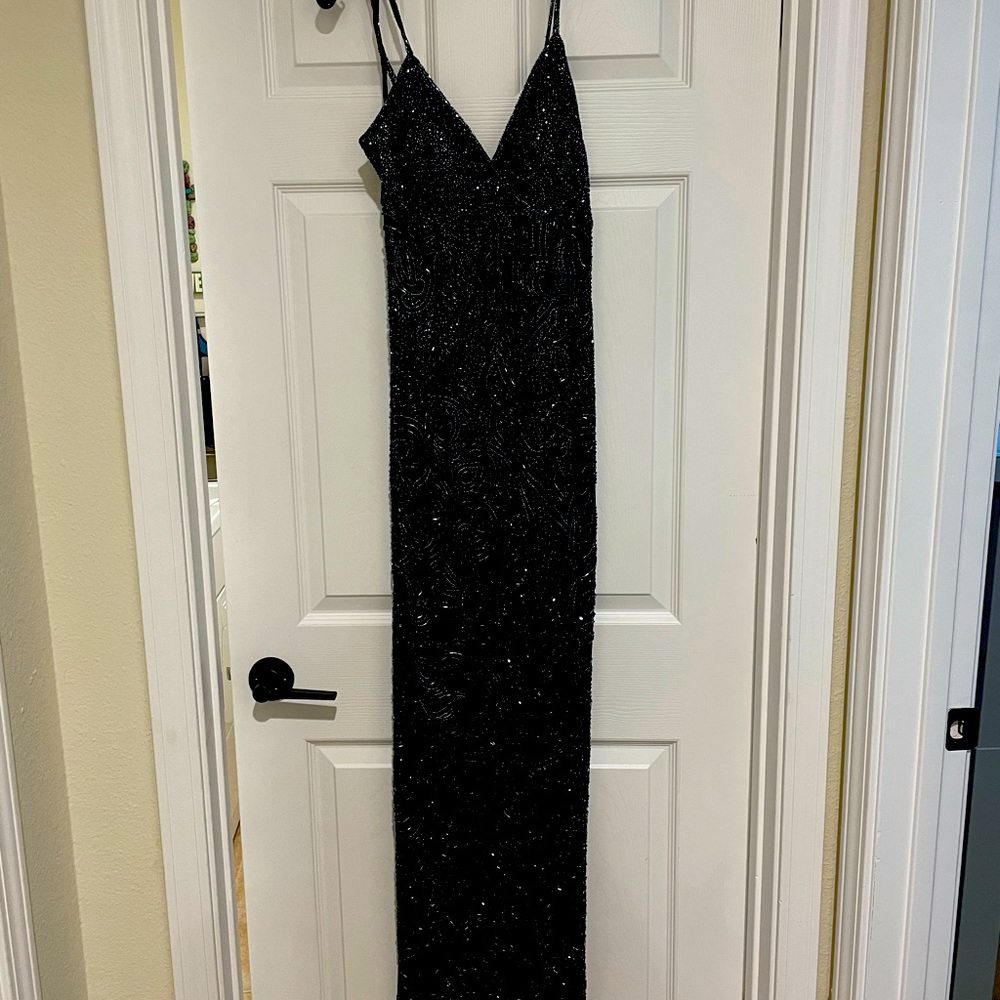 Long, black, beaded evening gown.